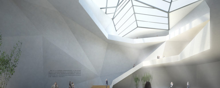 AQSO arquitectos office. The central atrium of the building is a space illuminated by a large skylight. The plasticity of its concrete walls reminds us of a natural cave dominated by the stairs leading to the upper level.