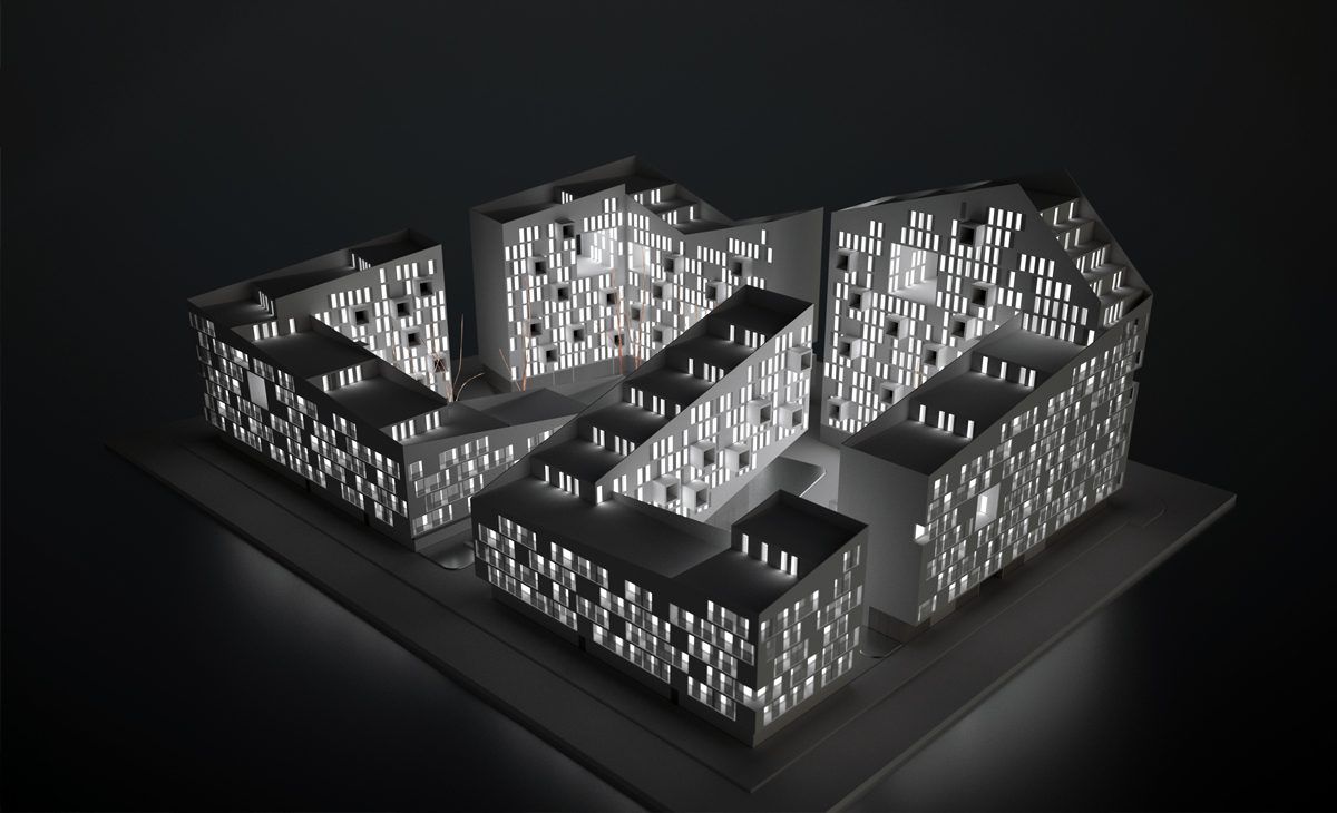 AQSO arquitectos office. Back-lighted architectural model of the residential complex where the zig-zag volume, the terraces and the courtyards can be appreciated.