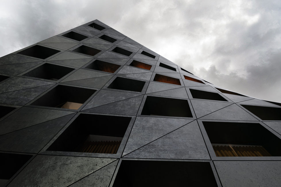 AQSO arquitectos office. Prefabricated facade made of lightweight concrete forming an ruled surface. Each of the windows corresponds to a hotel room.