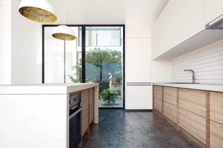 aqso arquitectos office, courtyard kitchen, metro tiles, concrete counter, kitchen island, concrete floor, oak timber, funtional design, kitchen cabinets, bright space