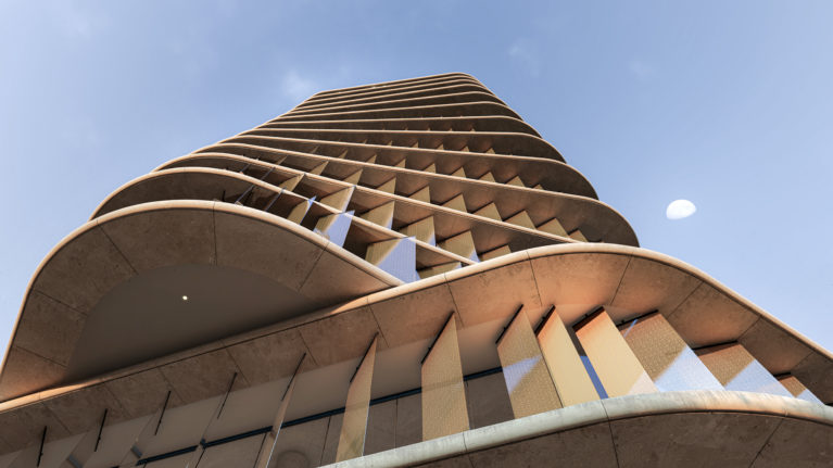 AQSO arquitectos office. Vista en contrapicado de la torre, donde la rotación de los pisos forma una sugerente silueta retorcida.