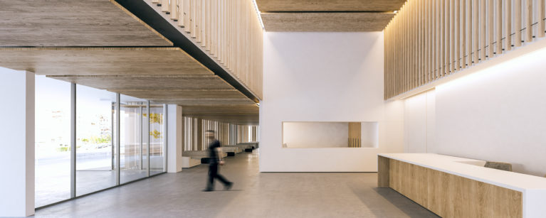 aqso arquitectos office, spacious entrance lobby of the public building. The timber slatting and white walls combine with concrete floors and glass walls. Modern reception desk.