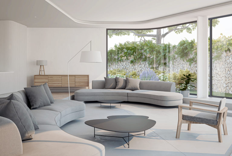 AQSO arquitectos office. La sala de estar, rehundida un escalón, forma un espacio acogedor y cómodo. El mobiliario moderno y funcional crea una atmósfera cálida y relajada.