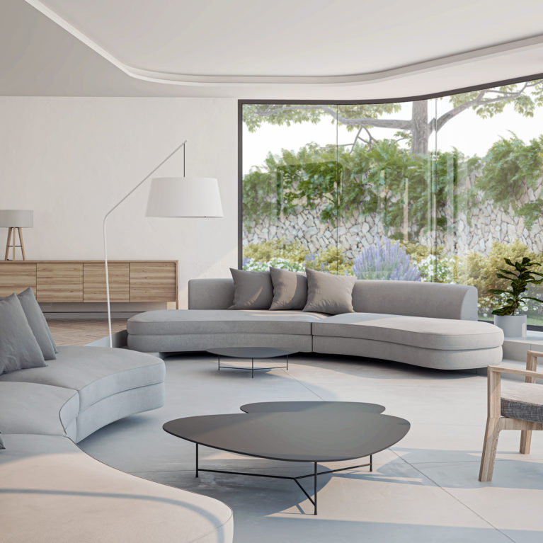AQSO arquitectos office. La sala de estar, rehundida un escalón, forma un espacio acogedor y cómodo. El mobiliario moderno y funcional crea una atmósfera cálida y relajada.
