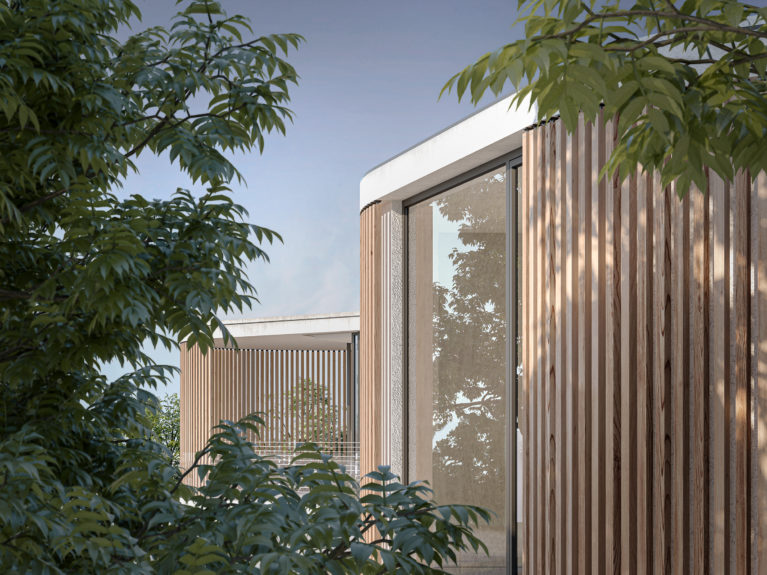 AQSO arquitectos office. The unique facade of the house can be seen through the trees around the plot. Wooden slats enclose the balcony to give privacy to the master bedroom.