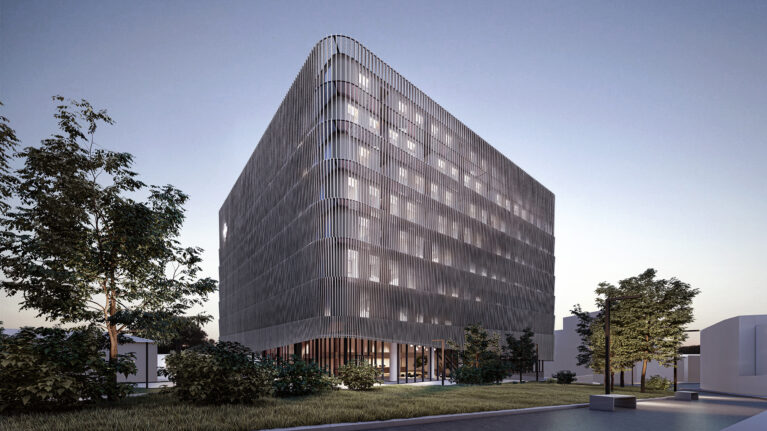 AQSO arquitectos office. The louvred facade works as a double skin wrapping the hospital, the facade behind shows a checkered pattern of openings.