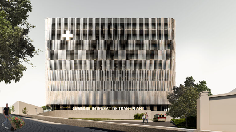 AQSO arquitectos office. The transplant centre is a modern building, compact in shape and with a functional arrangement. The minimalist aesthetic of the exterior resembles an institutional public building.