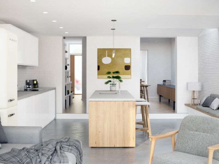 AQSO arquitectos office. The living room is arranged as an open plan, with a kitchen island in the middle and a roof light along the existing brick wall.