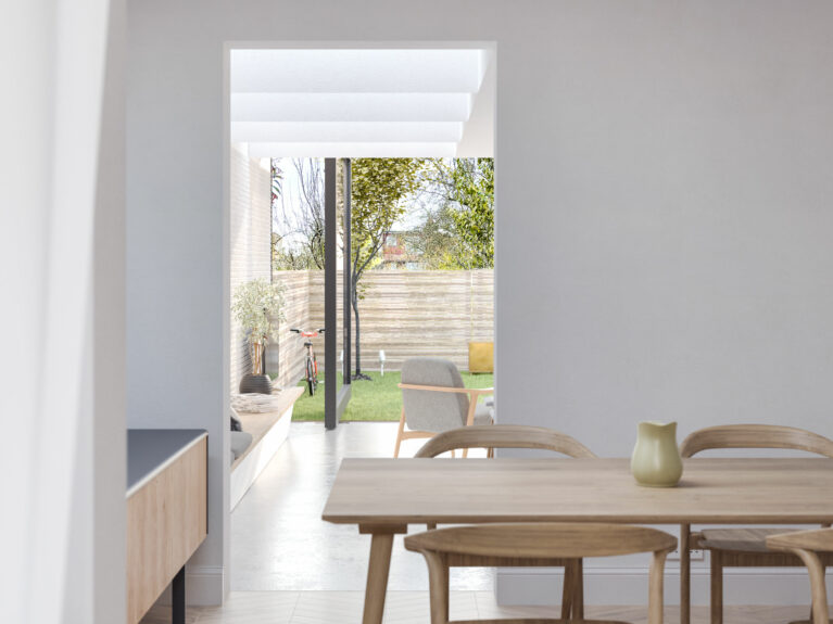 AQSO arquitectos office. From the dining room you can see the back garden of the house, separated by the threshold of the door. The open floor plan allows a visual connection between all the spaces.