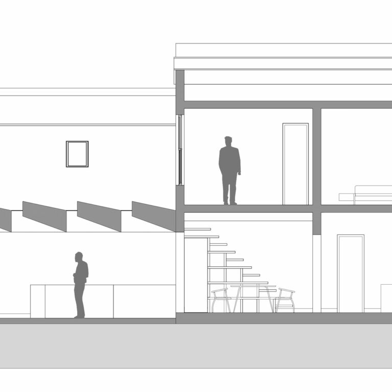 AQSO arquitectos office. The section of the building shows the spaciousness of the living room, the rooflights and the relationship between the original building and the new extension towards the garden.